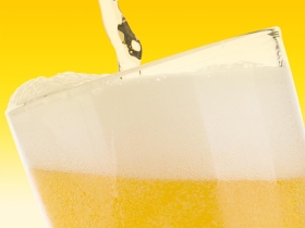 beer pouring into a glass