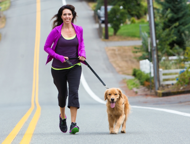 woman and dog jogging